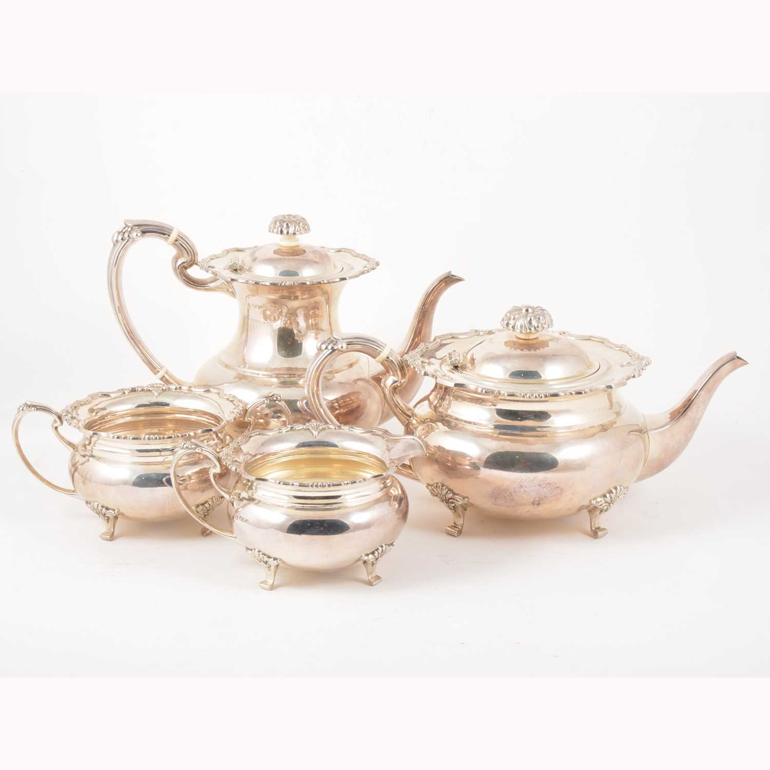 Lot 132 - A Victorian style four-piece silver tea and