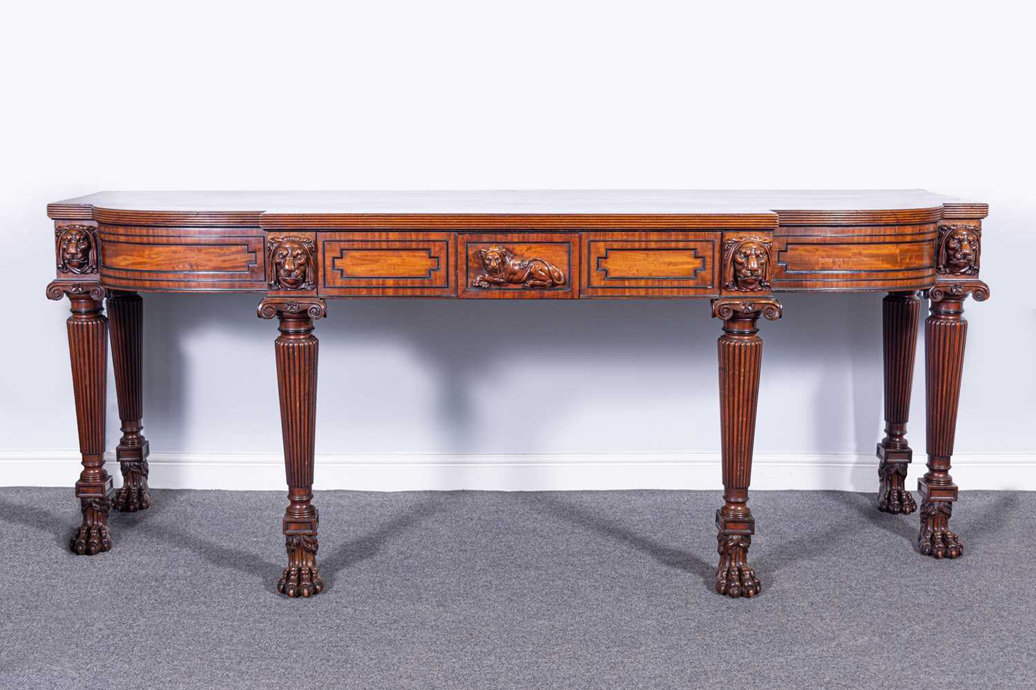 Lot 438 - A George III mahogany breakfront serving table, in the manner of Thomas Hope, circa 1810