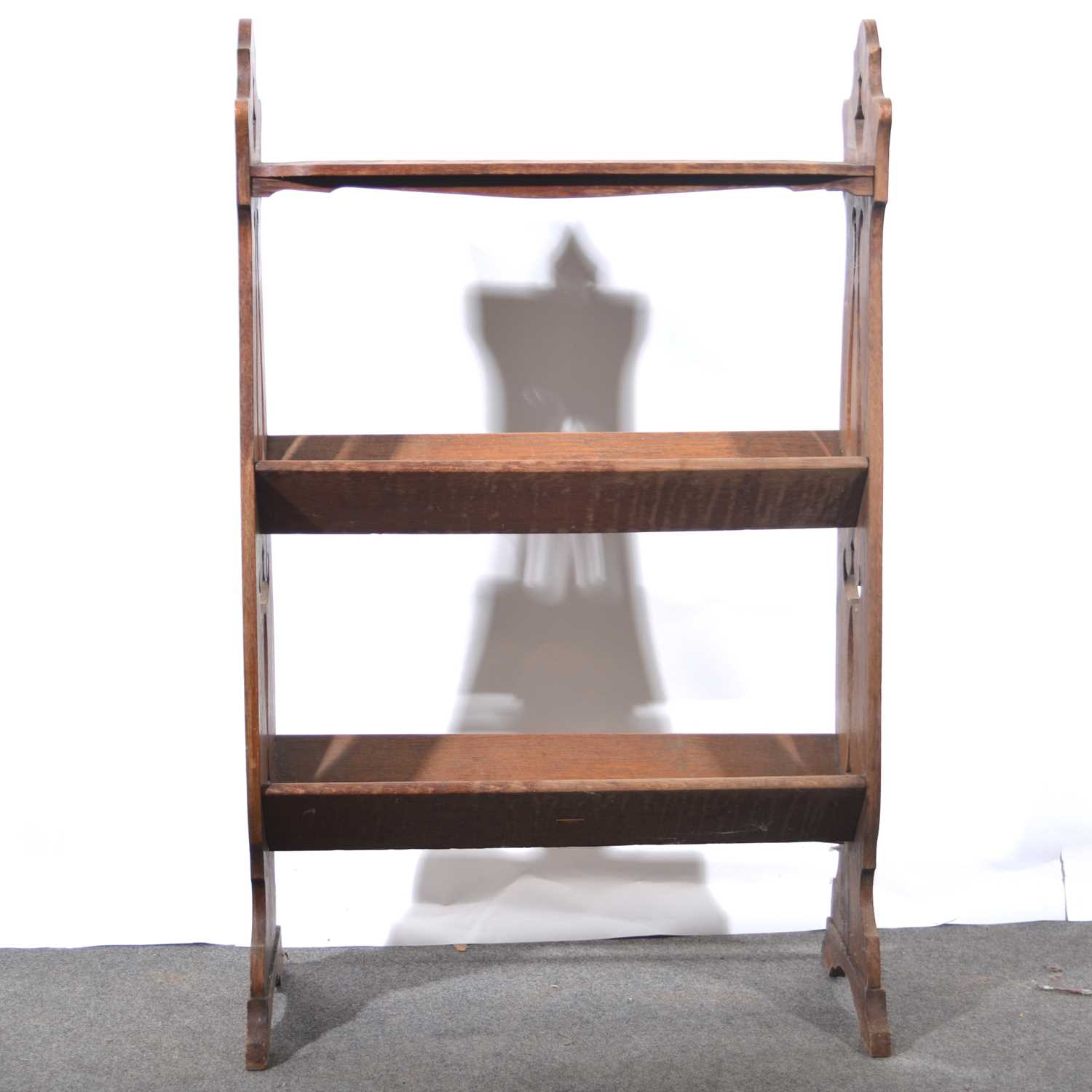 Lot 504 - Edwardian Art Nouveau style oak book rack.