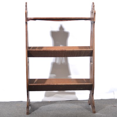 Lot 504 - Edwardian Art Nouveau style oak book rack.