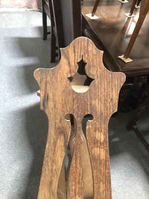 Lot 504 - Edwardian Art Nouveau style oak book rack.