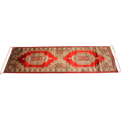 Lot 622 - Persian pattern red ground runner