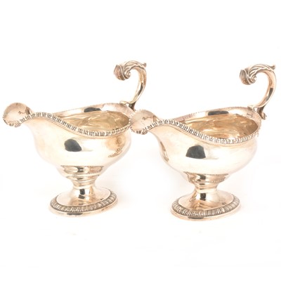 Lot 129 - A pair of George III silver sauce boats