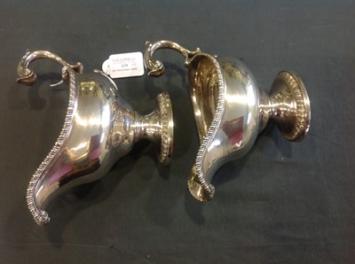Lot 129 - A pair of George III silver sauce boats