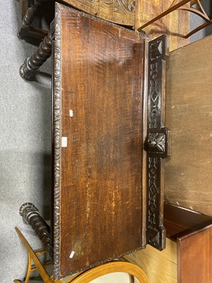 Lot 39 - A carved and stained oak hall table.