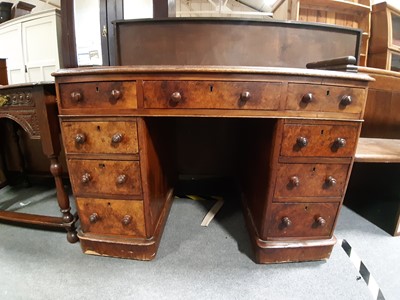 Lot 2 - A Victorian burr walnut twin pedestal desk.