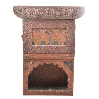 Lot 117 - A carved and stained oak wall cabinet.