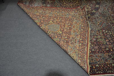 Lot 162 - A large Persian pattern carpet.