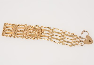 Lot 324 - A 9 carat yellow gold five bar gate link bracelet.