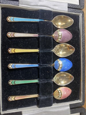 Lot 93 - A set of six silver gilt and enamel egg spoons