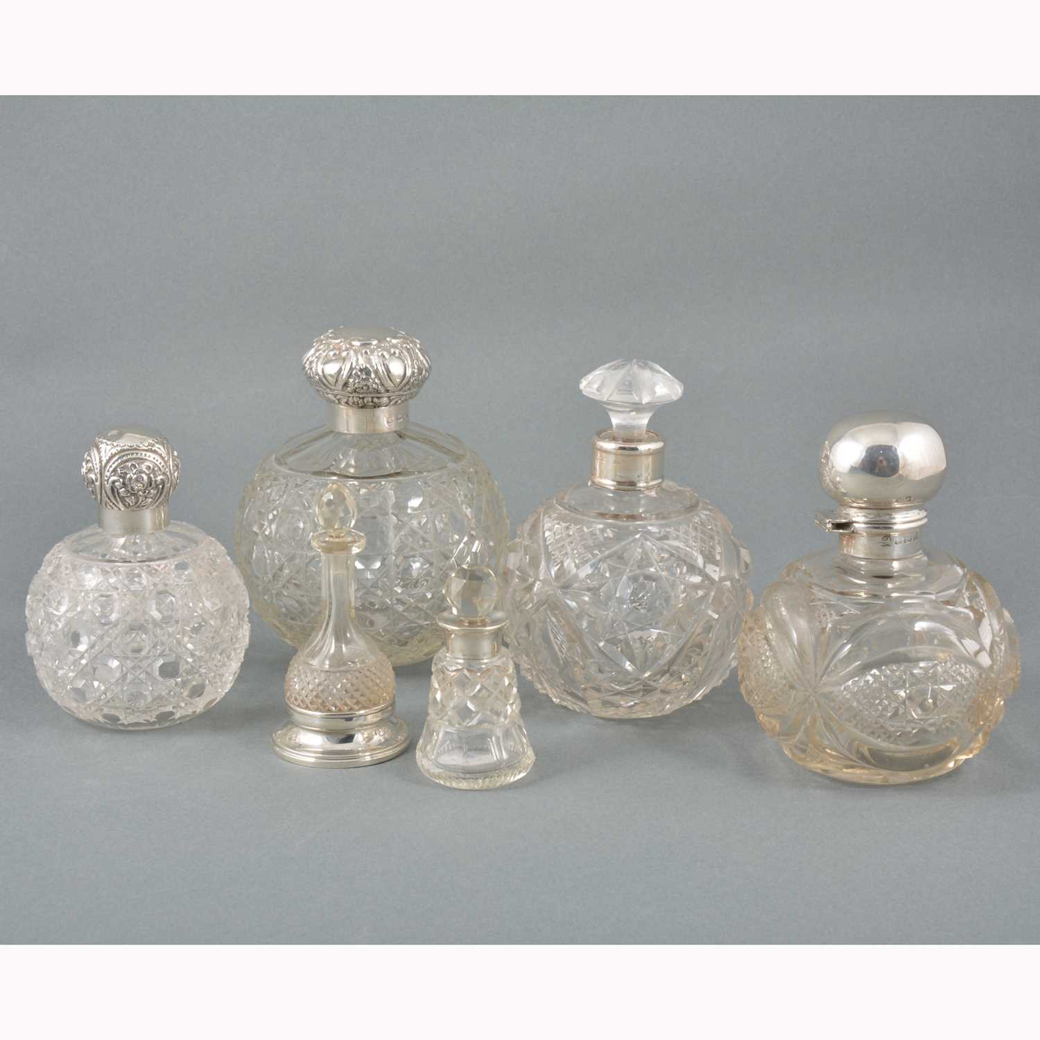 Lot 18 - Six cut-glass cologne and scent bottles.