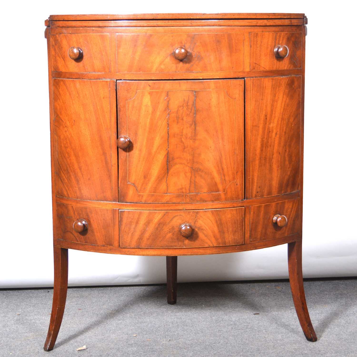 Lot 507 - Late Georgian mahogany gentleman's bowfront corner washstand