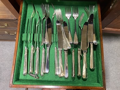 Lot 98 - An unusual mahogany slender canteen cabinet, and a twelve place setting of cutlery