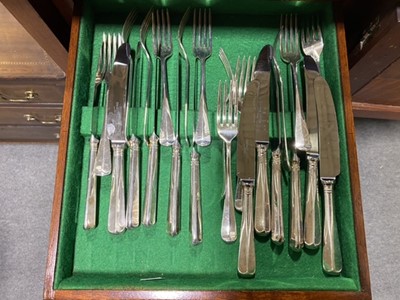 Lot 98 - An unusual mahogany slender canteen cabinet, and a twelve place setting of cutlery