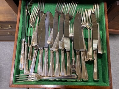 Lot 98 - An unusual mahogany slender canteen cabinet, and a twelve place setting of cutlery