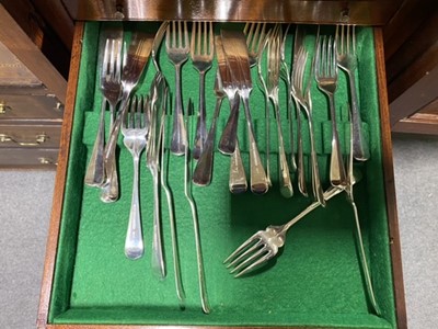 Lot 98 - An unusual mahogany slender canteen cabinet, and a twelve place setting of cutlery