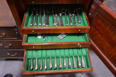 Lot 98 - An unusual mahogany slender canteen cabinet, and a twelve place setting of cutlery