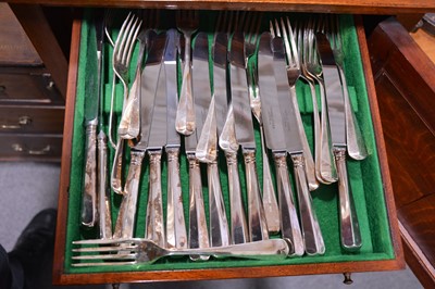 Lot 98 - An unusual mahogany slender canteen cabinet, and a twelve place setting of cutlery