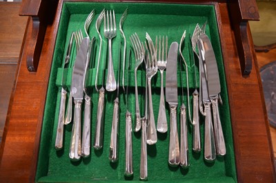 Lot 98 - An unusual mahogany slender canteen cabinet, and a twelve place setting of cutlery