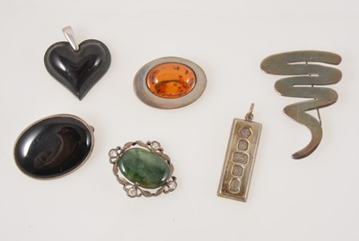 Lot 339 - A black Lalique heart pendant, a silver modernist brooch, etc.