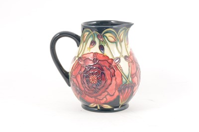 Lot 52 - A Moorcroft Pottery 'Eustoma' jug, designed by Carole Lovatt
