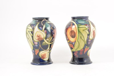 Lot 119 - A pair of Moorcroft Pottery 'Queens Choice' vases, designed by Emma Bossons