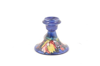 Lot 120 - A William Moorcroft 'Leaf and Berry' candlestick, circa 1935