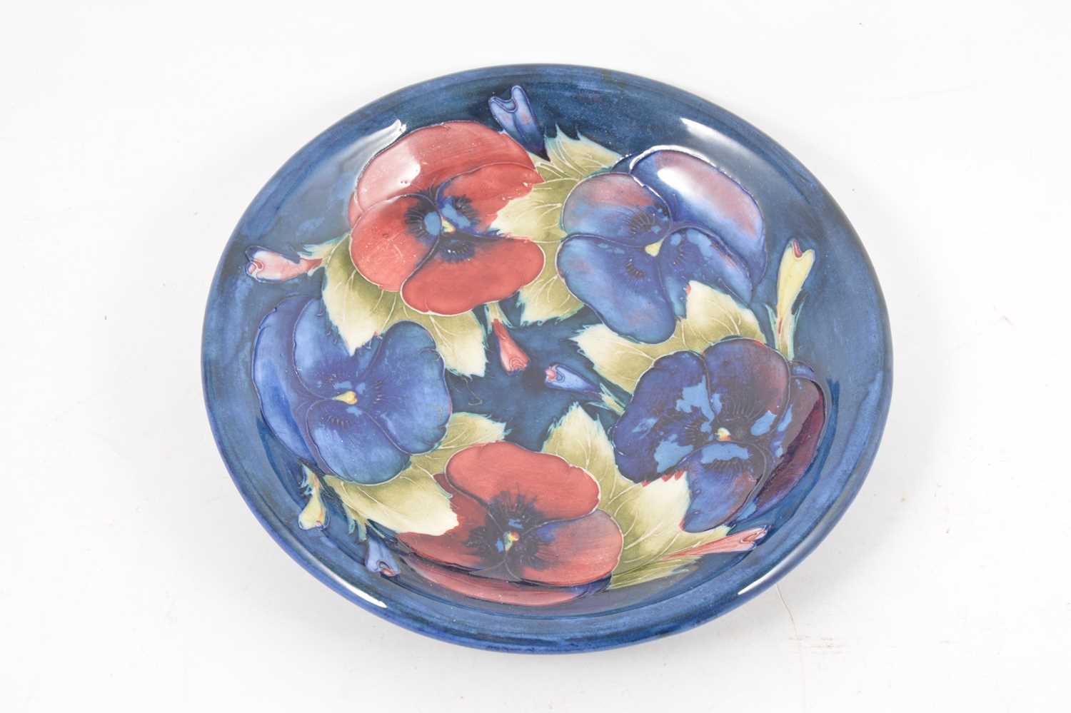 Lot 121 - A William Moorcroft 'Pansy' plate, circa 1928