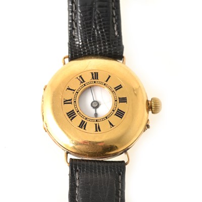 Lot 225 - An 18 carat yellow gold lady's half hunter wristwatch on a black leather strap