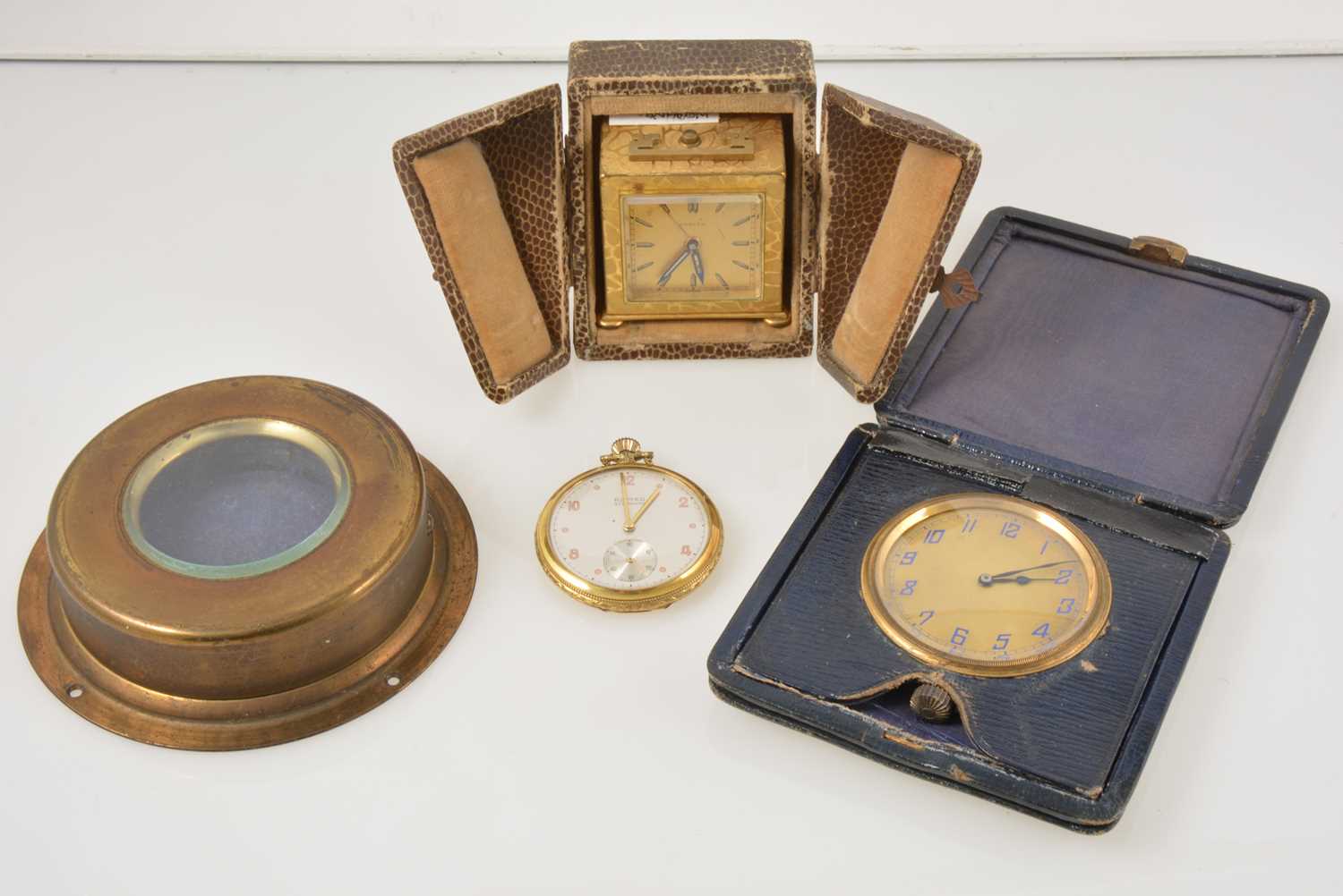 Lot 392 - A Zenith gilt metal travel alarm clock in fitted case, Romeo gold-plated open face pocket watch