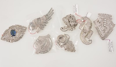 Lot 357 - Eight quality unmarked paste set dress clips and brooches in the style of Trifari