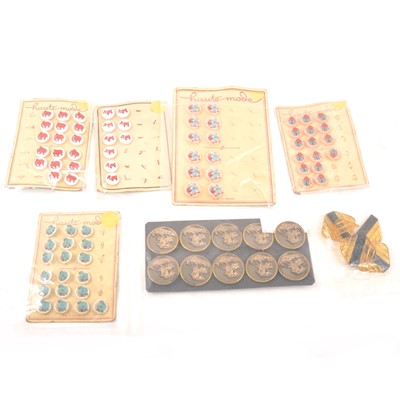 Lot 208 - A collection of mostly carded vintage buttons, novelty, plastic and bakelite, metal.