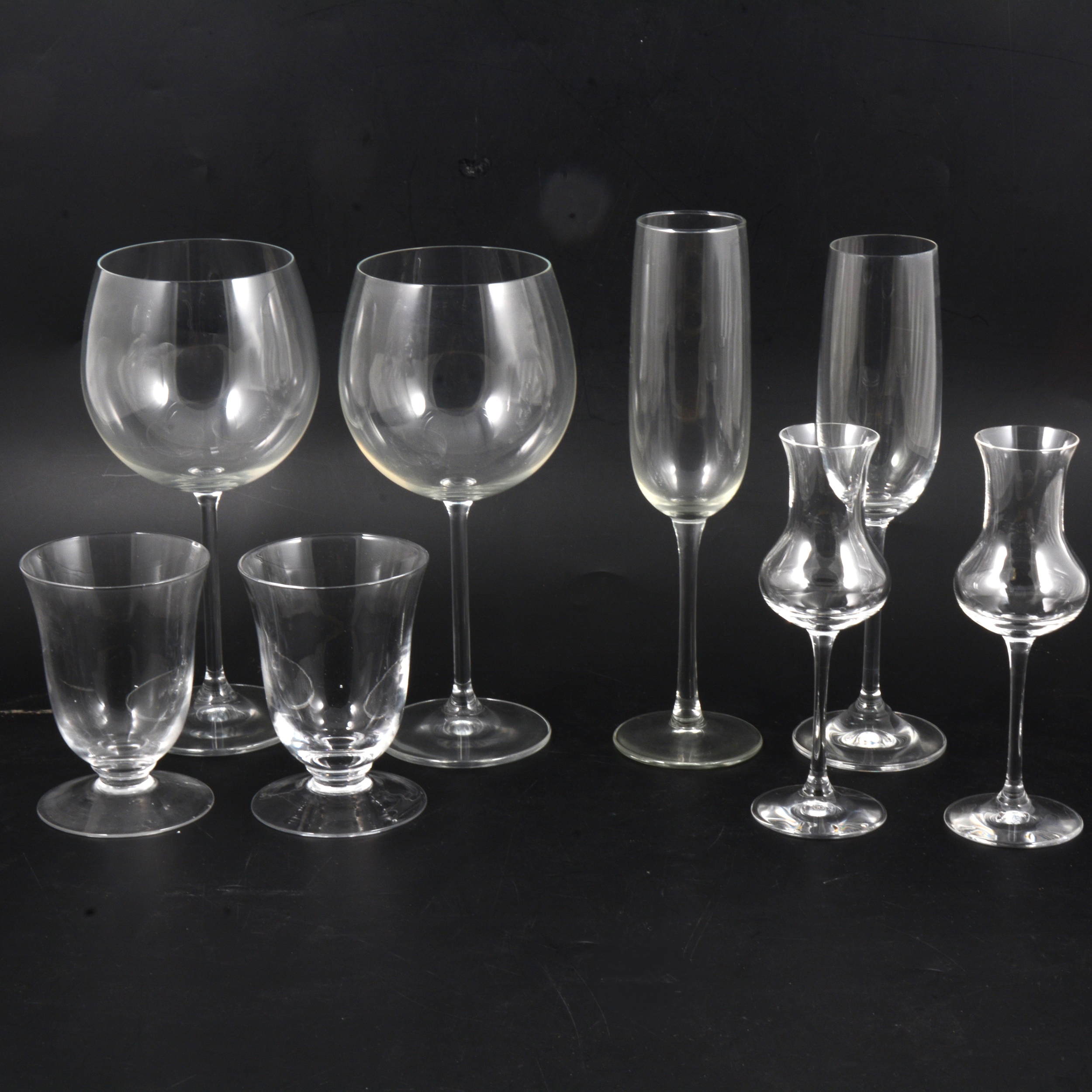Lot 132 Suite of pedestal table glasses.