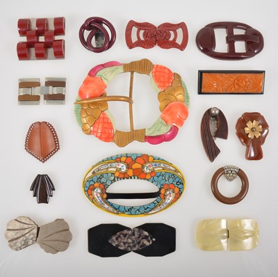 Lot 358 - A collection of vintage costume jewellery bakelite, celluloid and plastic belt buckles and dress clips.