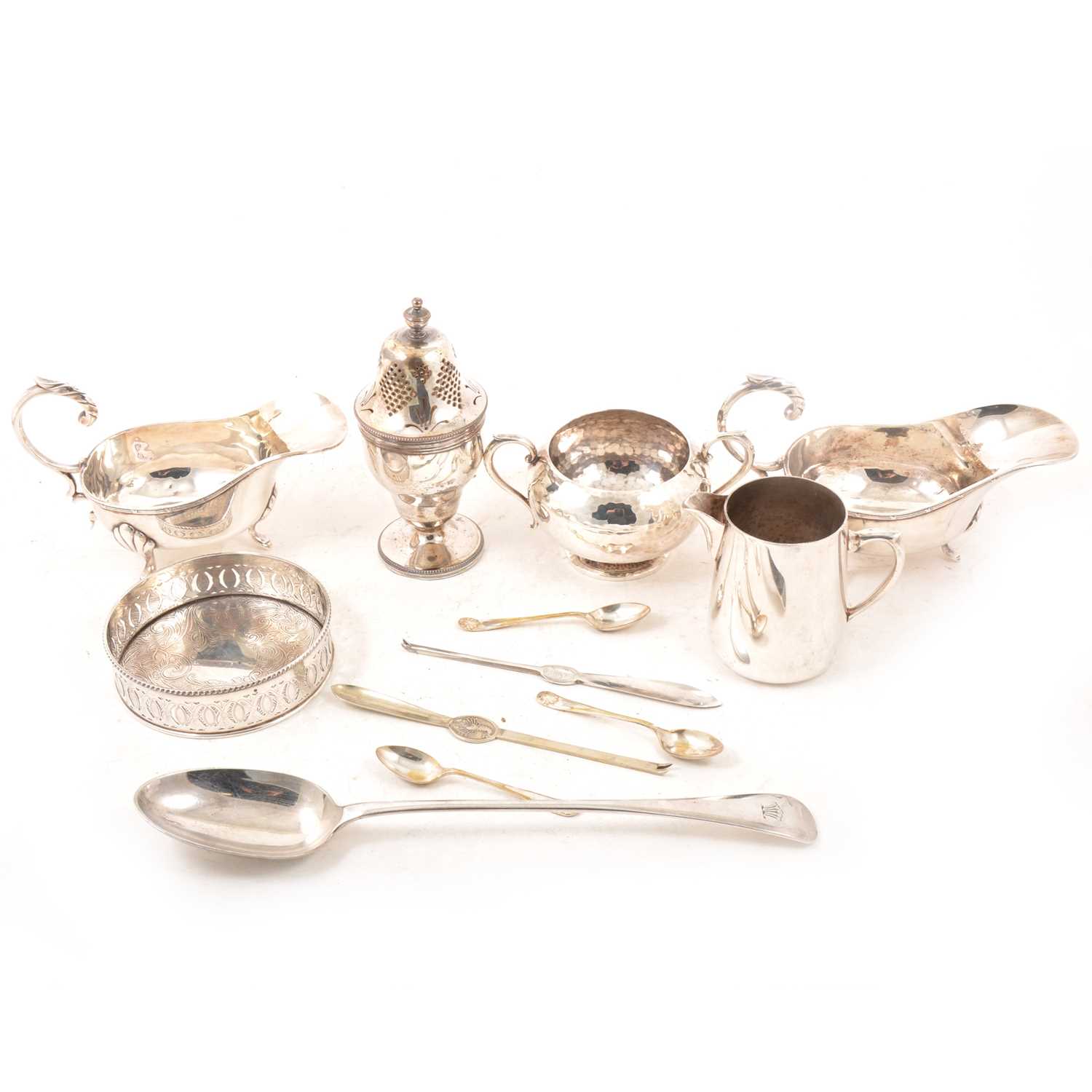 Lot 133 - Silver-plated bottle coaster, sugar bowl, pair of sauce boats, lobster picks, basting spoon.