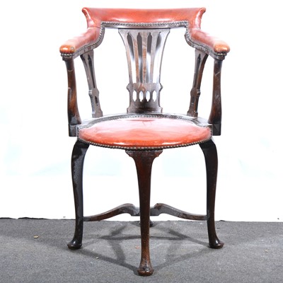 Lot 117 - An Edwardian walnut and leather upholstered armchair.