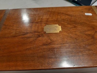 Lot 130 - A Victorian walnut and brass bound writing box