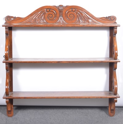 Lot 429 - A stained wood three heights wall shelf