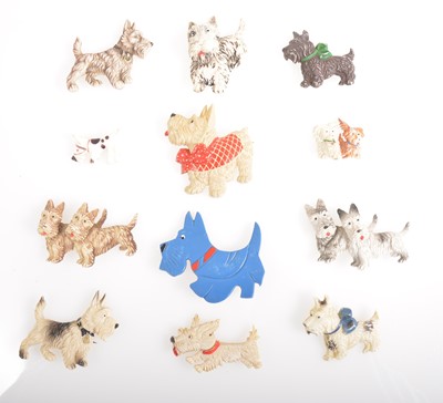 Lot 363 - Twelve vintage celluloid and plastic Scottie dog brooches.