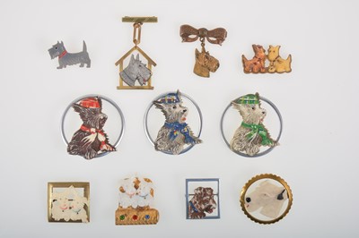 Lot 353 - A Scottie dog lipstick holder and ten Scottie brooches with metal detail.