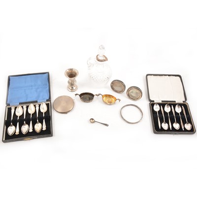 Lot 323 - A selection of silver and white metal items, to include teaspoons, compact, silver rimmed liqueur decanter etc.