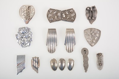 Lot 361 - Eighteen 1930's and later white metal dress clips and brooches.