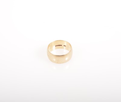 Lot 328 - A 9 carat yellow gold wedding band.