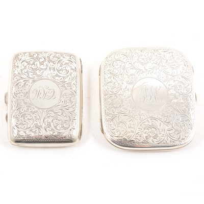 Lot 318 - Two silver cigarette case, both with scroll engraving and monogrammed cartouche.