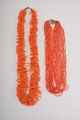 Lot 376 - Two miniature coral bead multi strand necklaces.