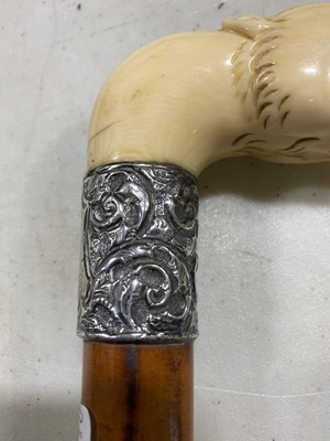 Lot 101 - A Victorian ivory head and silver-banded walking cane