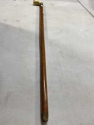 Lot 101 - A Victorian ivory head and silver-banded walking cane
