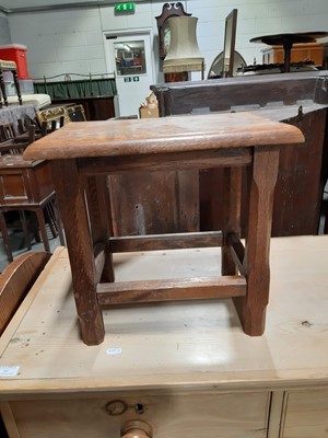 Lot 24 - A reproduction cast iron pub table, and an oak stool.