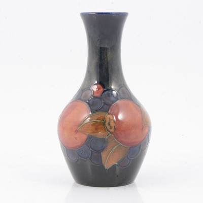 Lot 150 - William Moorcroft, a 'Pomegranate' pattern bottle vase.
