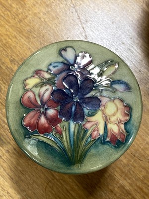 Lot 153 - William Moorcroft, a 'Spring Flowers' pattern cylindrical jar and cover.
